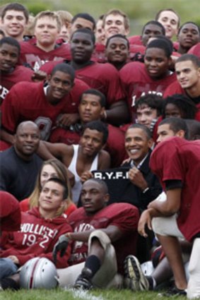 President Barack Obama with the La Follette High School football team in Wisconsin.