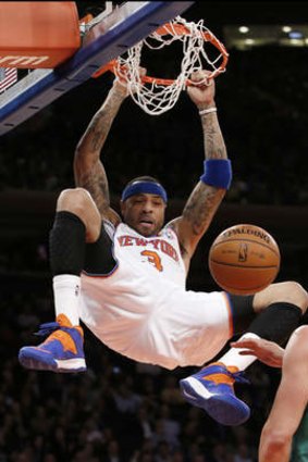 New York Knicks forward Kenyon Martin dunks in front of Boston Celtics center Kris Humphries at Madison Square Garden.