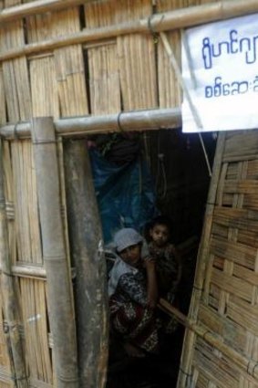 A notice on the outside of a Rohingya home in Myanmar's Rakhine state reads "will accept (census) check if (you) accept Rohingya".