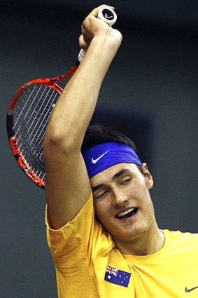 Top shot: Bernard Tomic in action against China's Zhang Ze last month.