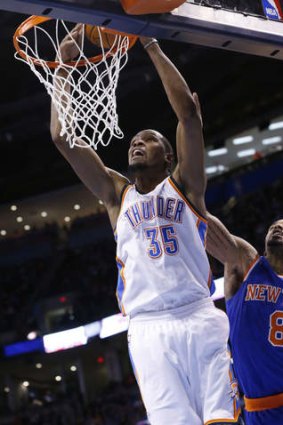 Oklahoma City Thunder forward Kevin Durant is fouled by New York Knicks guard J.R. Smith while shooting in Oklahoma City. The Thunder won 112-100.