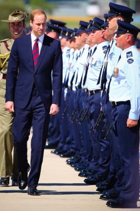 Prince William inspects an honour guard at RAAF Base Amberley.
