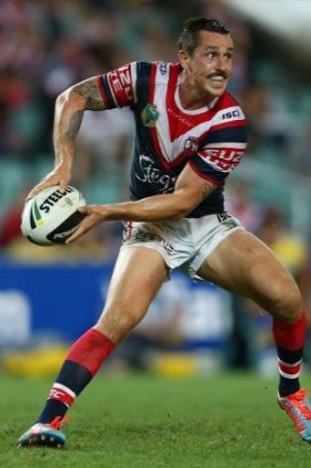 Half the battle: Mitchell Pearce takes on Parramatta in round two.