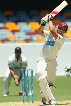 Luke Pomersbach hits a boundary during his innings of 73.
