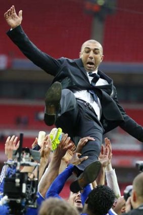 How quickly he forgets ... Chelsea coach Roberto Di Matteo is thrown in the air by players after their FA Cup final soccer match against Liverpool.