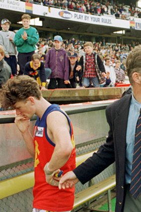Coach Alan McConnell walks off Football Park after Fitzroy's last match against Adelaide.