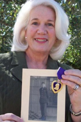 Suzanne Mitchell, a great-niece of Sergeant Richard Owen's widow, Ruth - with the lost picture of the paratrooper and his Purple Heart.