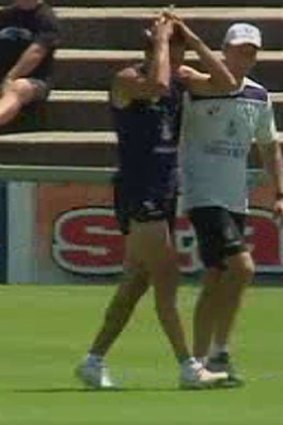 Luckless Anthony Morabito was accompanied by coach Ross Lyon as he underwent further assessment of a knee injury. <b>Photo:</b> Channel 10.