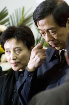 Spectacular fall ... Bo Xilai and his wife, Gu Kailai, attend his father's funeral in Beijing in January. Bo has since been stripped of positions, and his wife implicated in the murder of a British businessman.