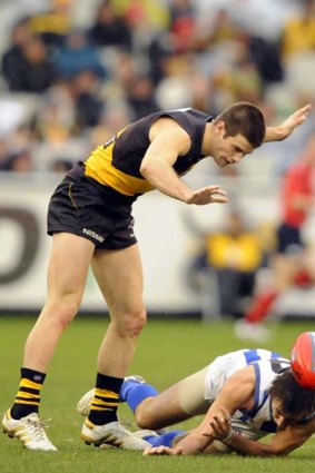 Richmond's Trent Cotchin was reported for a charge on North's Sam Wright.