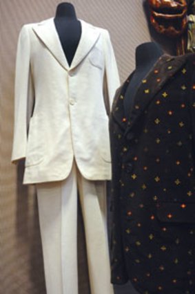 Auction items ... The white suit John Lennon wore on the cover of the The Beatles' Abbey Road album and the blazer he wore during his video for the song "Imagine."