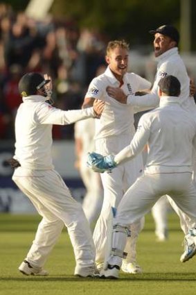 Stuart Broad is mobbed by teammates in Durham.