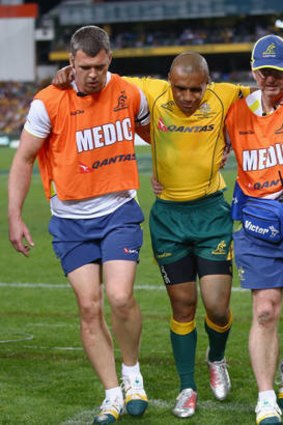 Wallaby Will Genia is helped from the field with an injury during Rugby Championship match between Australia and the South Africa at Patersons Stadium in Perth on September 8.