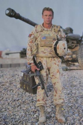 Then... Sergeant Major Paul Chapman in Helmand Province, Afghanistan in 2011.