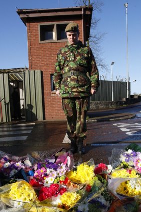 Paying respect...Brigadier George Norton, the British Army Commander in Northern Ireland, visits the Massereene Barracks, where two soldiers were killed.