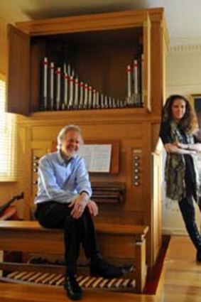 Douglas Lawrence and wife Elizabeth Anderson with their pipe organ, which they custom built into the house.