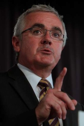 Independent MP Andrew Wilkie says Eddie McGuire is using 'inflammatory terms' by labelling pokie reforms a 'footy tax'.