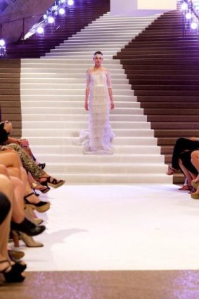 A model descends the stairway in The Face Australia.