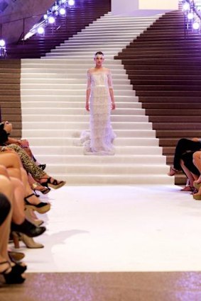 A model descends the stairway in The Face Australia.