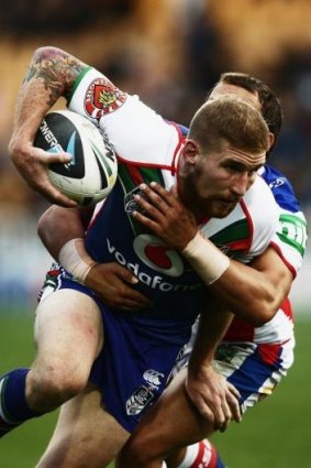 On the charge: Sam Tomkins of the Warriors.