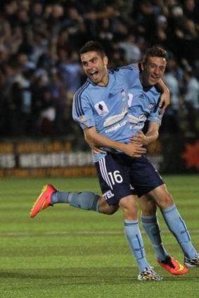 Announcing himself: Christopher Naumoff celebrates one of his two goals for Sydney FC during Tuesday's FFA Cup win over Sydney United.