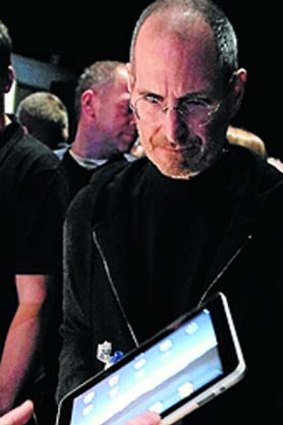 Apple's Steve Jobs with the original iPad.