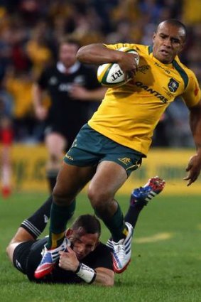 On the mark: Wallabies' Will Genia avoids a tackle before scoring for the Wallabies.