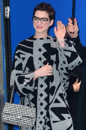 Bon draper: Anne Hathaway enveloped in a Burberry Prorsum cloth coat.