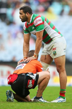 Set to fill in: Greg Inglis receievs attention on Friday night.