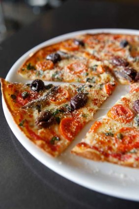 The one dish you must try ... Puttanesca pizza, with mozzarella, cherry tomatoes, anchovies, capers and black olives, $20.