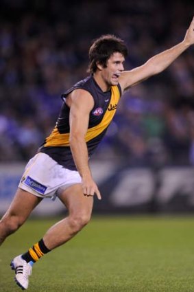 Trent Cotchin is facing suspension for jabbing Kane Cornes in the midriff on Saturday night.