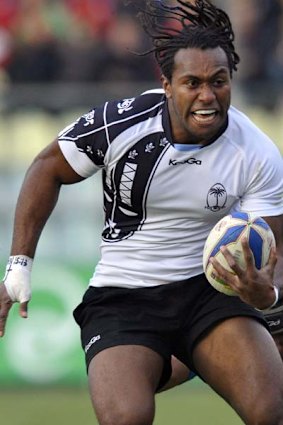 Albert Vulivuli is tackled by Italy's Santiago Dellape.