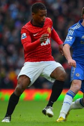 Manchester United's Patrice Evra (left) vies with Chelsea's Juan Mata.
