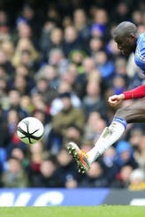 Manchester United's English defender Chris Smalling vies with Chelsea's Senegalese striker Demba Ba. Ba's strike would go on to make the difference for the home side.