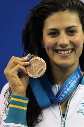 Stephanie Rice poses with her bronze medal for the Women's 400m Individual Medley Final at the FINA World Championships, July 31, 2011.