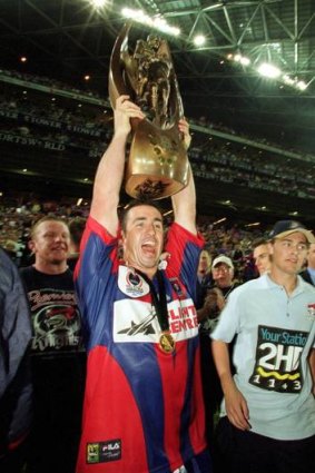 Andrew Johns with the NRL premiership trophy in 2001.