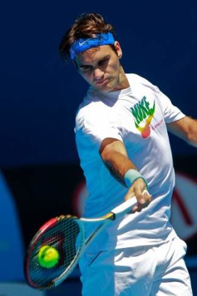 Roger Federer warming up at Melbourne Park.