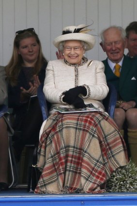 When a referendum on Scottish independence failed to alter the status quo, the Queen's public appearances continued unabated. She watches the caber being tossed at the annual Braemar Highland Gathering in Braemar, Scotland, last year. Phoro: Reuters