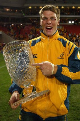 Clyde Rathbone celebrates victory with the Cook Cup during a match between the Wallabies and England in 2004.