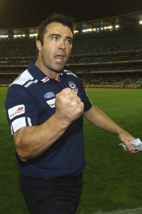 Geelong coach Chris Scott celebrates his team's  victory over St Kilda in round one.