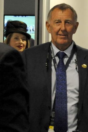 Racehorse owner John Singleton and trainer Gai Waterhouse leave the stewards’ room at Royal Randwick in Sydney on Saturday.