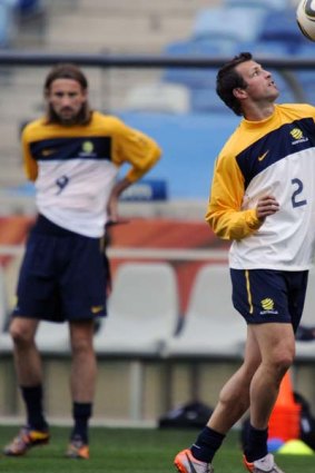 Lucas Neill takes part in an official training session on the eve of their 2010 Football World Cup group D football match against Germany.
