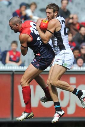 Demon James Sellar goes up but Port's Jay Schulz ends up getting the ball.
