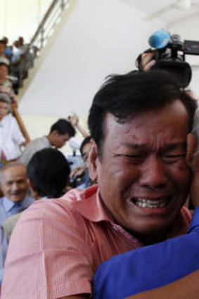 Cambodian former Khmer Rouge survivors, Soum Rithy, left, and Chum Mey.