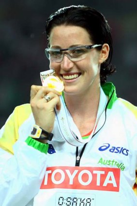 Jana Rawlinson receives the gold medal for winning the women's 400m hurdles final at the world championships, August 30, 2007.