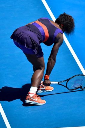 Serena Williams smashes her racquet during her loss to Sloane Stephens.
