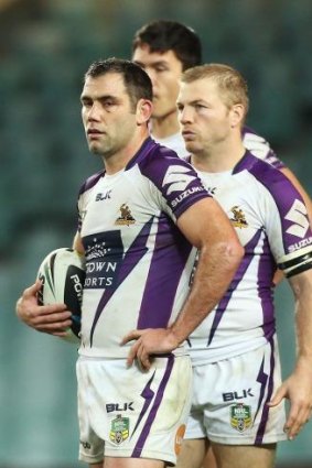 Cameron Smith looks dejected after conceding a try to the Roosters.
