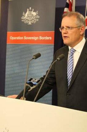 Immigration minister Scott Morrison addresses journalists.