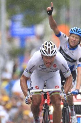 Ryder Hesjedal celebrates as teammate Thor Hushovd with's the 18th stage of the Tour de France.