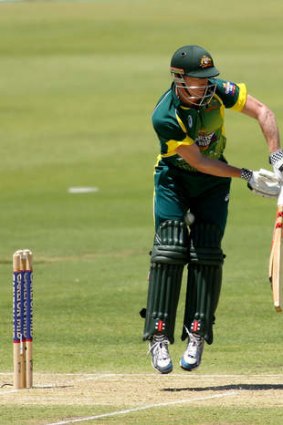George Bailey of Australia has the ball trapped between his legs during game one of the men's one day international series.